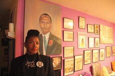 Mary Franklin, 56, is shown in her Roslindale apartment, where the walls are crowded with keepsakes of her late husband Melvin and of her own work as an advocate for survivors of homicide in the city. 		Caleb Nelson photo